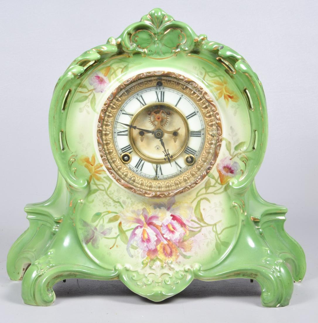 Ansonia Porcelain Royal Bonn Case Clock: Ansonia porcelain Royal Bonn case clock, open escapement, 8-day, model LA RIVIERE, pendulum, 12" x 14" x 5", detached back, small chip on back foot, hairlines