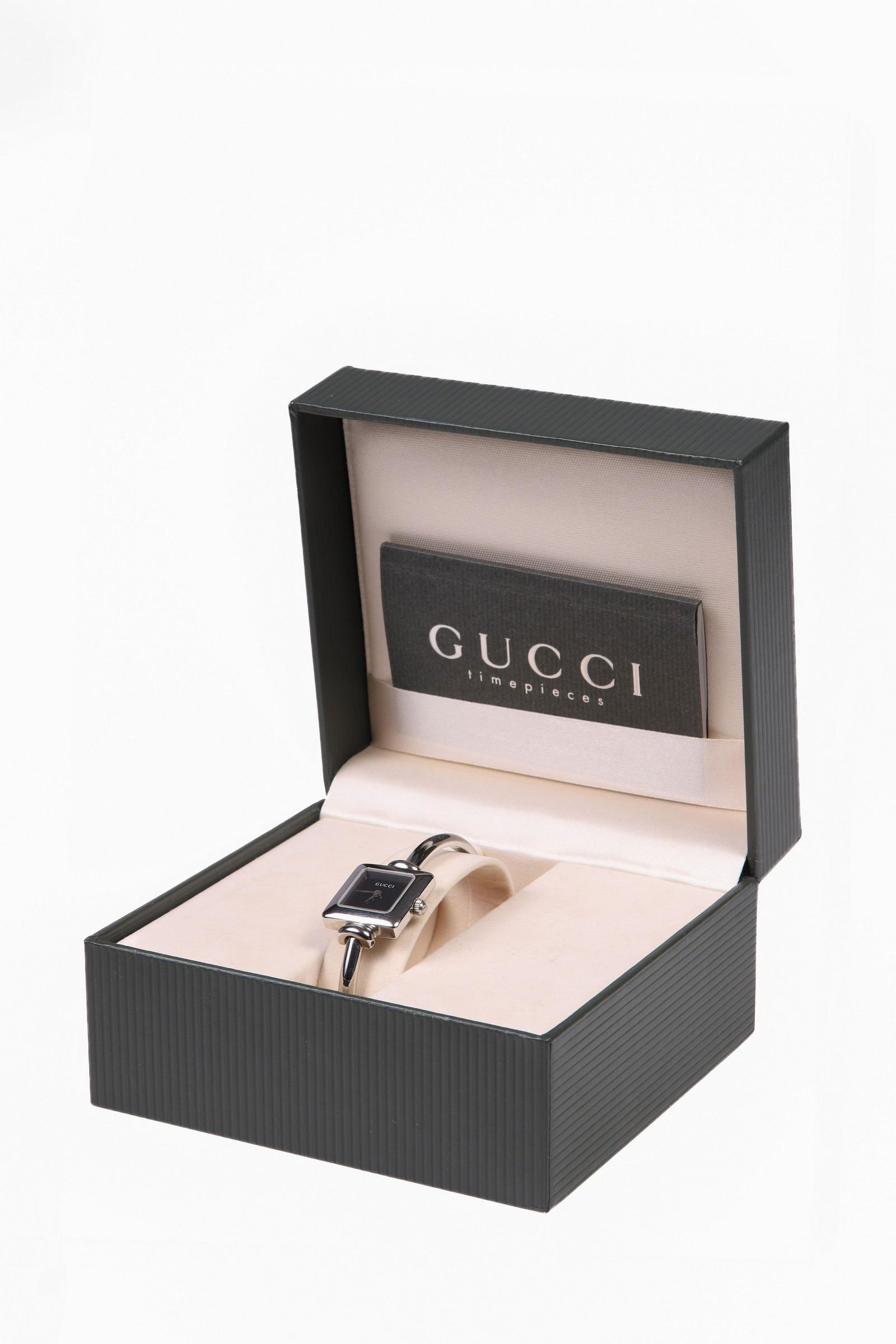 Ladies Gucci Watch: (1) Ladies Gucci watch in its original box and all paperwork, needs battery. Black dial ladies bracelet.