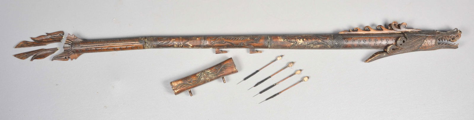 Chinese Carved Bone Dragon Dart Gun: Chinese carved bone dragon dart gun, with (4) darts, 34" l, tail needs repair