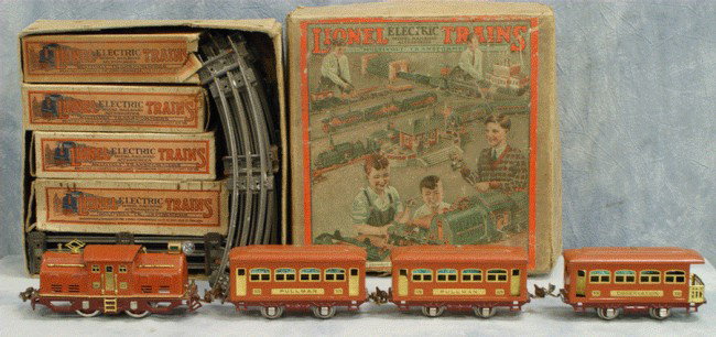 Lionel passenger train set #294, terra cotta color: Lionel passenger train set #294, terra cotta color, locomotive 252, cars 530, (2) 529, with original boxes and track, small transformer