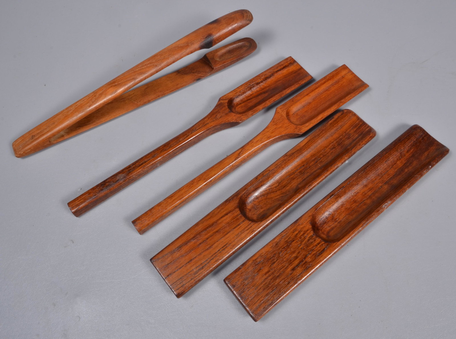 Dansk Wood Serving Implements: Dansk wood serving implements to include (2) Pairs Quistgaard serving tongs, 12" and 13-1/2" and joined tongs, 13-1/2"L