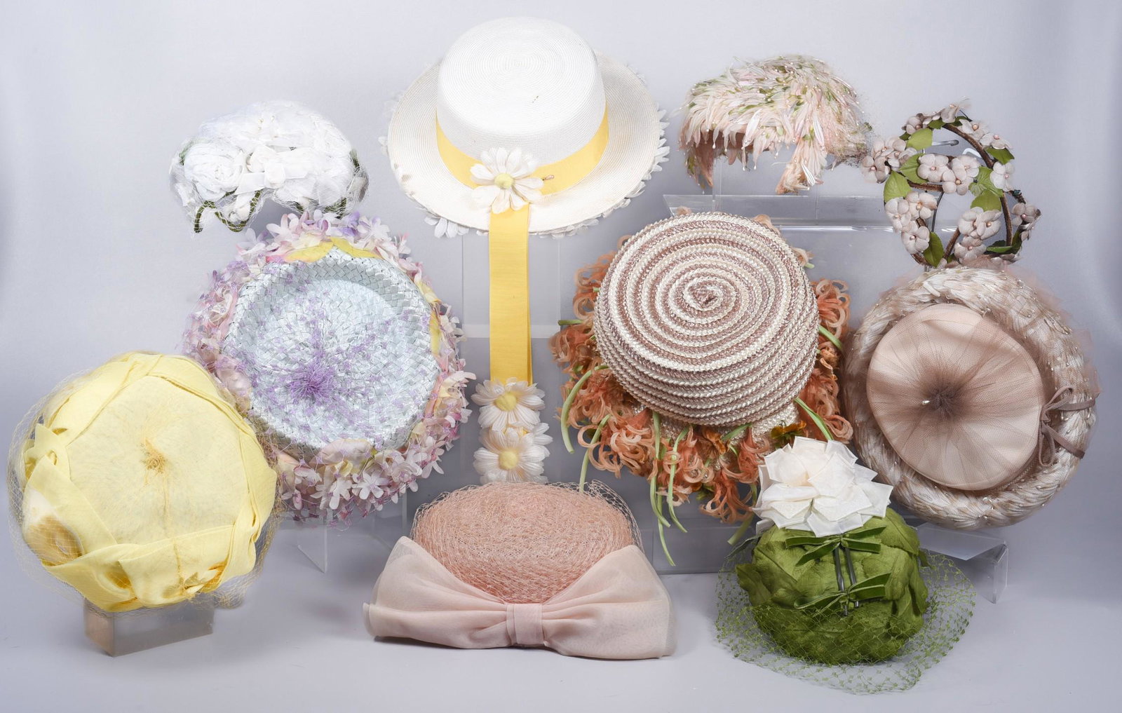 (10) 50's/60's Raffia and Floral Summer Hats: (10) 50's/60's Raffia and floral summer hats to include faux pearl and flower petal capulet, velvet framed floral adorned capulet, Norman Durand spun net pillbox with bow at back, Bernallen Modes whit