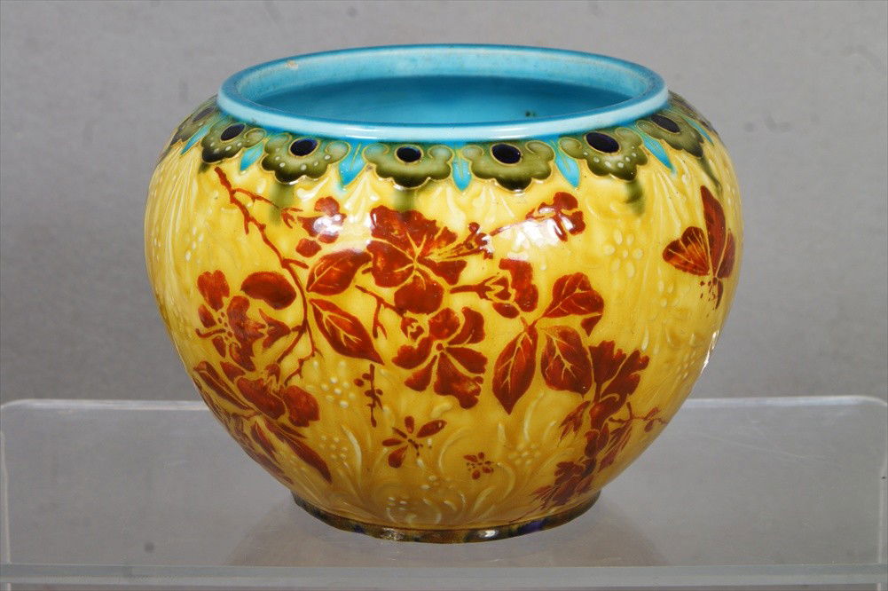 Theodore Deck earthenware bowl, transparent glaze: Theodore Deck earthenware bowl, transparent glaze with enameled borders in turquoise and olive green, containing an iron red bird on branch design all over a gold and ivory raised background, turquois