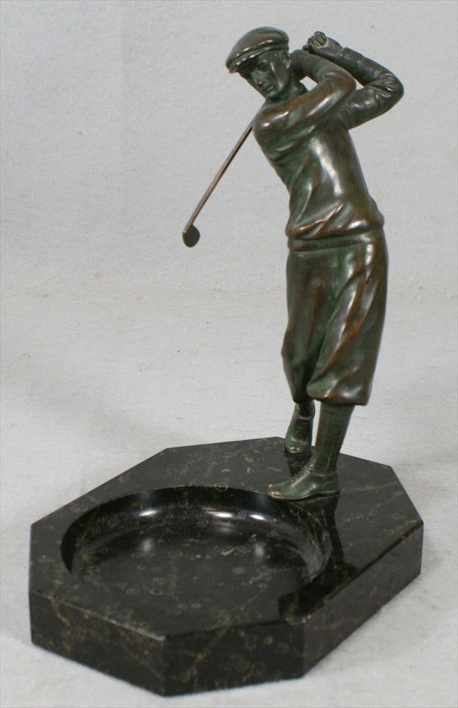 Bronze sculpture of a golfer on a black marble as: Bronze sculpture of a golfer on a black marble ashtray base, marked Germany, 9 1/2" tall