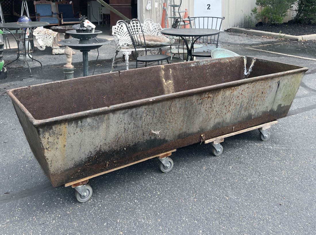 Large iron trough: Large iron trough, 17"h x 86"w x 26, surface rusting welding to one side