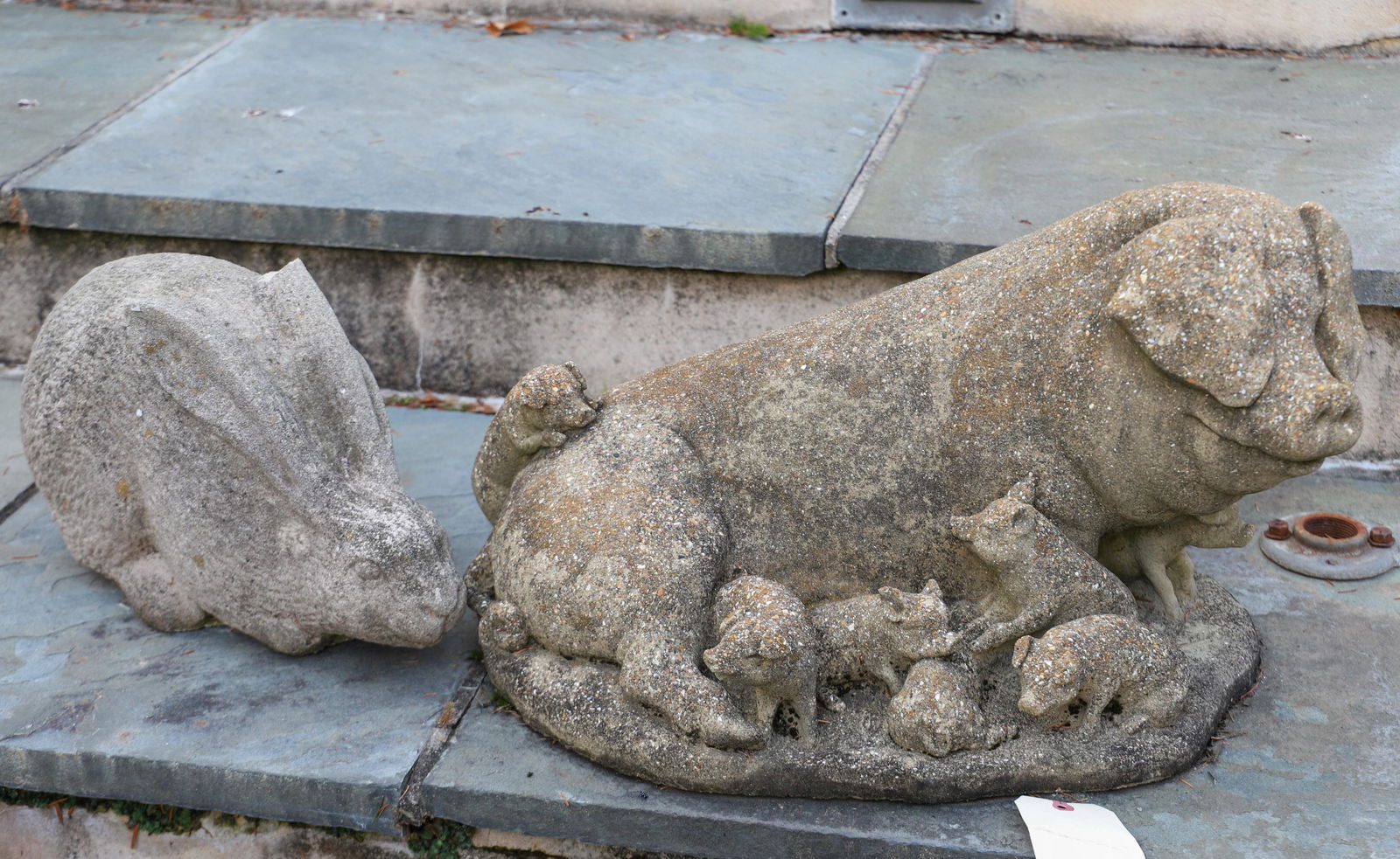 (2) Cement animal figures: (2) Cement animal figures, c/o pig with piglets, and rabbit with damaged ear, largest 14"h x 25"w