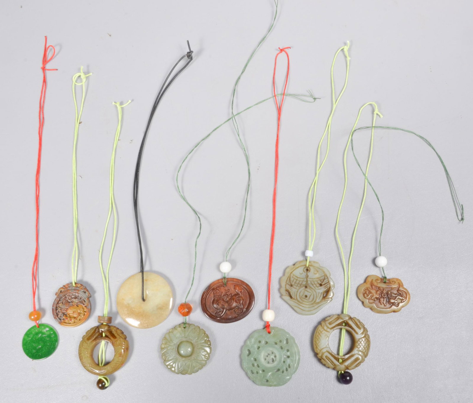 (10) Chinese Carved Stone Medallions: (10) Chinese carved stone medallions, largest 2-1/4" dia