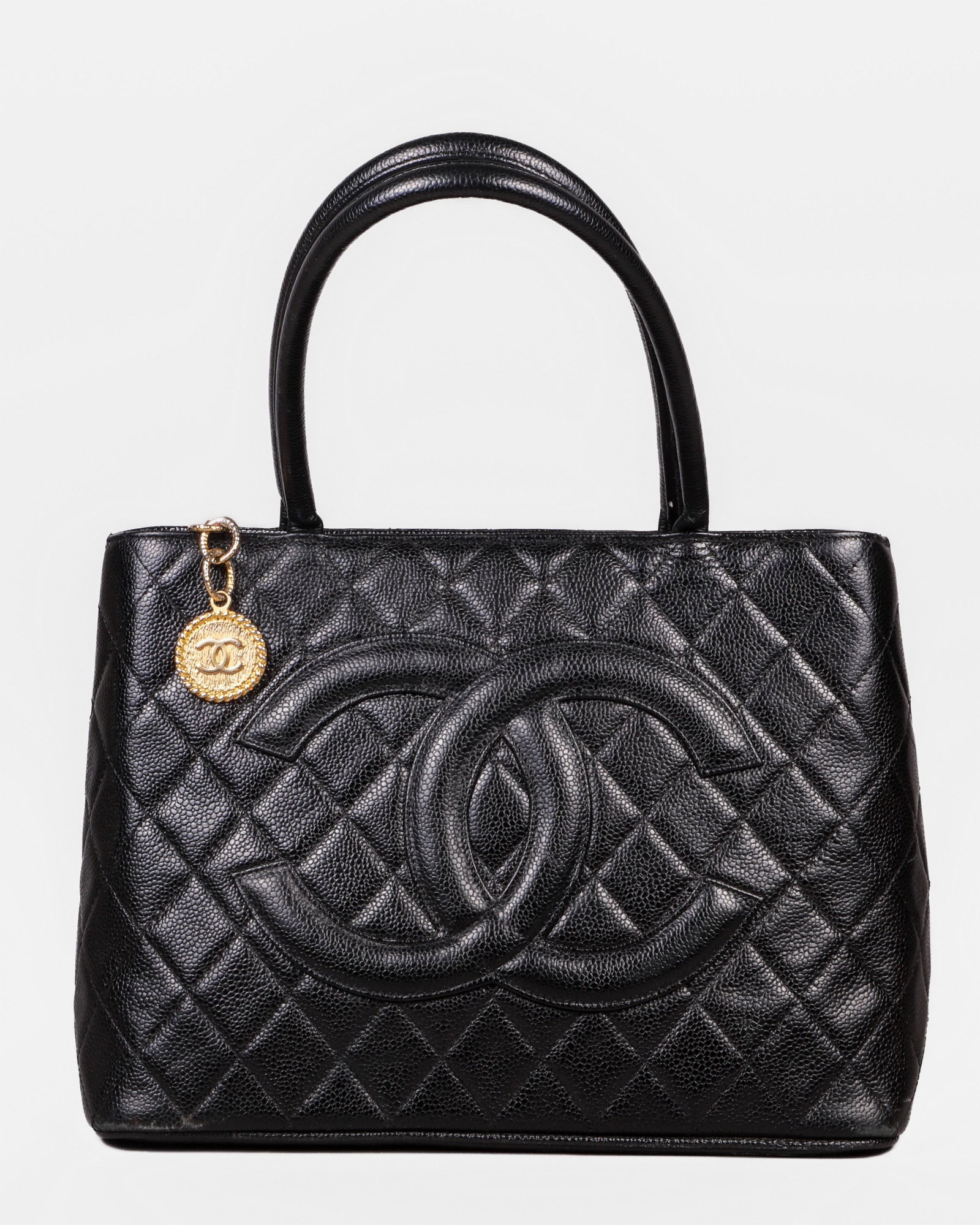 Chanel Style Medallion Purse: Chanel style medallion purse, caviar-type composition, jacquard lined, 13" x 10", very good condition.