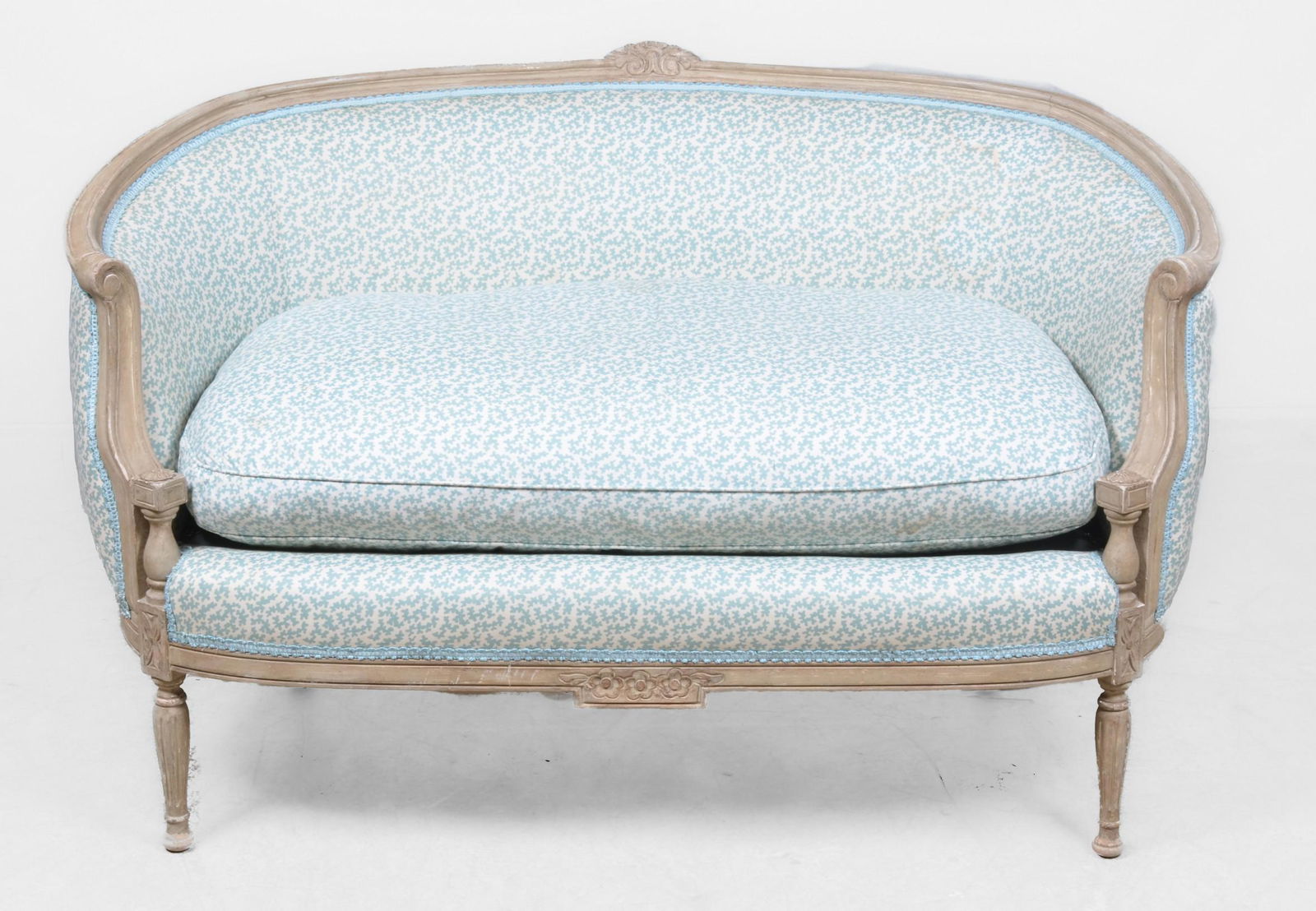 Louis XVI Style Settee: Louis XVI Style Settee with rounded back, ivory painted finish, in geo cream and blue cotton, feather fill, some spots to cushion, 52-1/4"L;22"D; 31"H