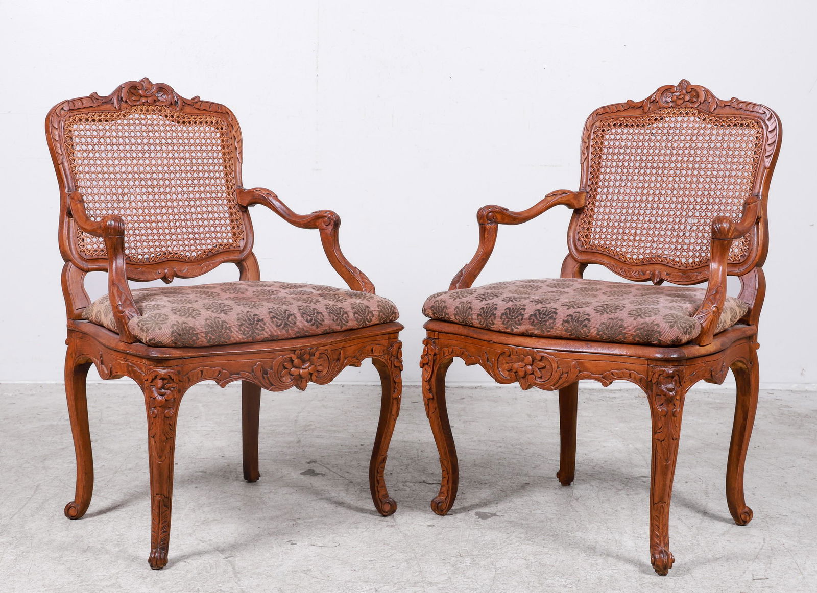 Pair Louis XV style carved walnut and caned open armchairs (1 of 3)