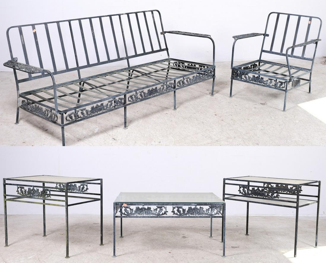 (5) pc Woodard style pierced metal patio seating set: (5) pc Woodard style pierced metal patio seating set, c/o 3-seat sofa, lounge chair, two tables, and coffee table, pierced white metal floral decoration, sofa 30"h x 65"w x 26"d, one table missing gla