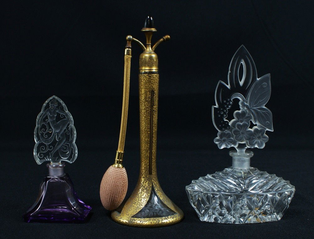 Three perfumes, Gold Atomizer with bird and floral: Three perfumes, Gold Atomizer with bird and floral etching, 9-3/4" h, Purple Art Nouveau Lady Signed "Ingrid, Czechoslovakia", 6" h, Butterfly Signed "Czechoslovakia", 8-1/2" h.