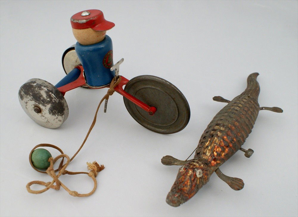 Two Toys, Tin Wind Up Alligator, unmarked, painted: Two Toys, Tin Wind Up Alligator, unmarked, painted, 10-1/2" l, working, and Gong Bell Mfg Co, Toy Tricycle, pull string, 5" h, working.