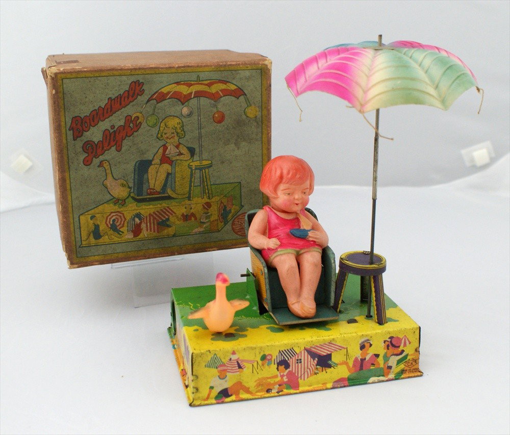 Boardwalk Delight Tin and Celluloid Wind Up Toy, w: Boardwalk Delight Tin and Celluloid Wind Up Toy, with box, Umbrella is missing tassels, box reads Bestmaid, Trademark CK, Made in Japan, Pat 17491, 9" h, working.