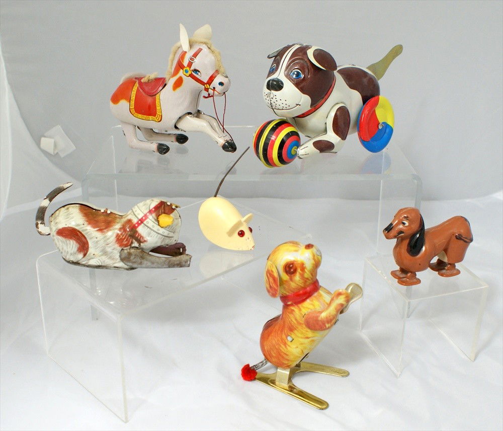 Group of Six Toys, Jumping Tin Dog, works, and Pla: Group of Six Toys, Jumping Tin Dog, works, and Plastic Dog, and German Plastic Mouse with wheels, and Tin wind up cat, no key, and Tin Wind up horse, made in China, and Tin wind up dog, made in China.