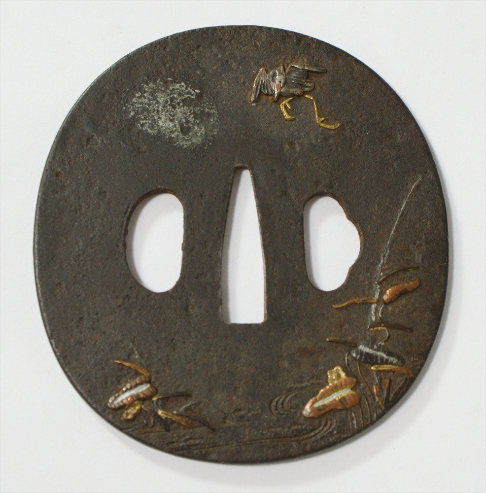 Tsuba, Edo Period, Iron applied mixed metal crane : Tsuba, Edo Period, Iron applied mixed metal crane and water lily petals, 3-1/8 x 2-7/8".