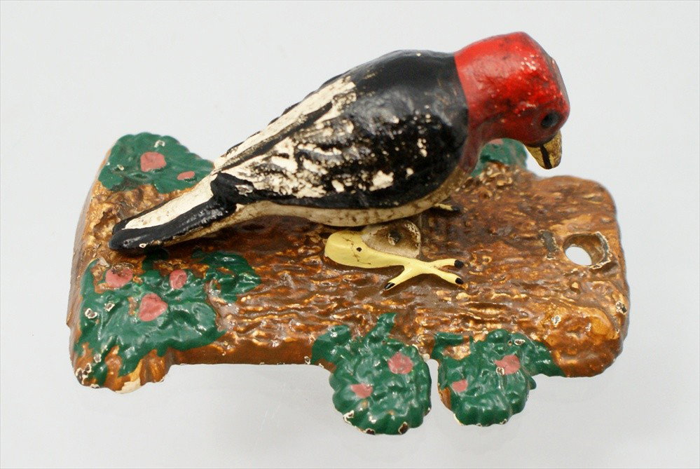 Hubley Cast Iron Woodpecker Door Knocker, marked ": Hubley Cast Iron Woodpecker Door Knocker, marked "251", bird articulated to tree form, 3-¾"h, minor wear.