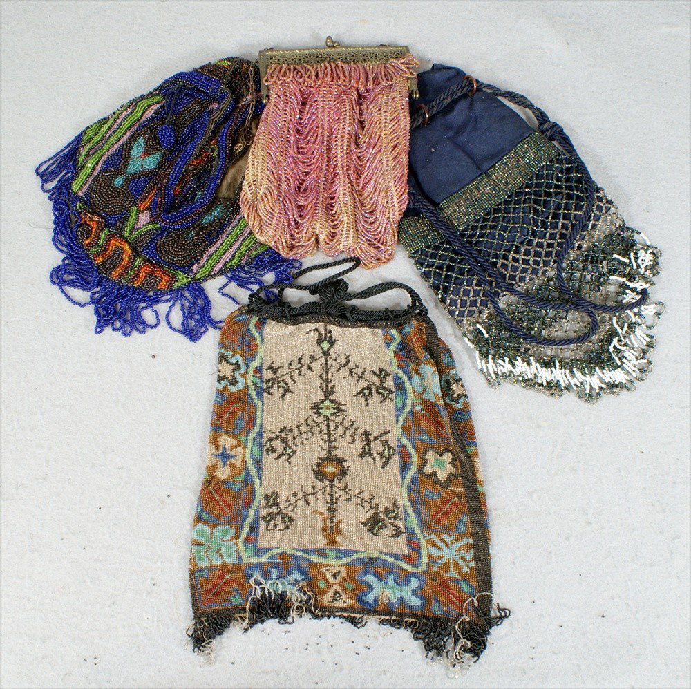4 Beaded Purses, 1 Pink Flapper Bag, 1 Black multic: 4 Beaded Purses, 1 Pink Flapper Bag, 1 Black multicolored bag with black tree pattern, 1 Multicolored bag, holes, and 1 blue cloth and beaded bag, average 8" long, all have bead loss.