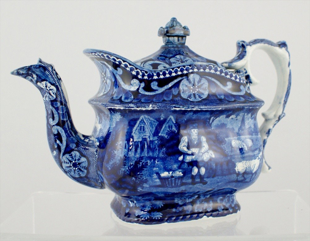 Historical Blue Transferware Teapot, Shepherd wit: Historical Blue Transferware Teapot, Shepherd with sheep, 11-1/2" l, 6-3/4" h, small chip on pot and lid.