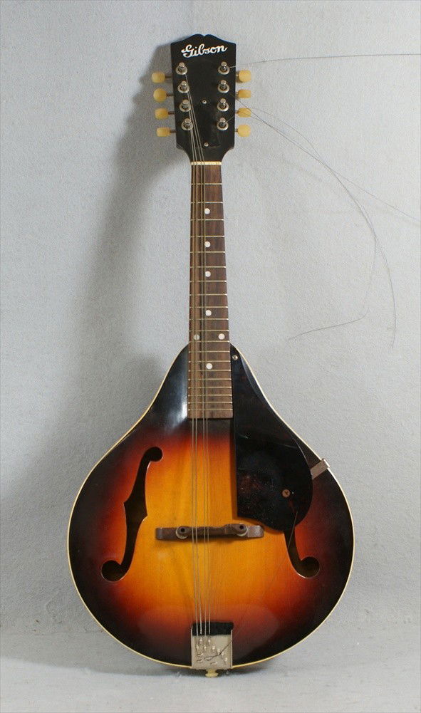 Vintage Gibson A-50 Mandolin, c1940, sunburst finis: Vintage Gibson A-50 Mandolin, c1940, sunburst finish, bound sides and fingerboard, adjustable bridge, some wear on pick guard, hard shell case. Stamped number in interior is "667 F" and then a pencil