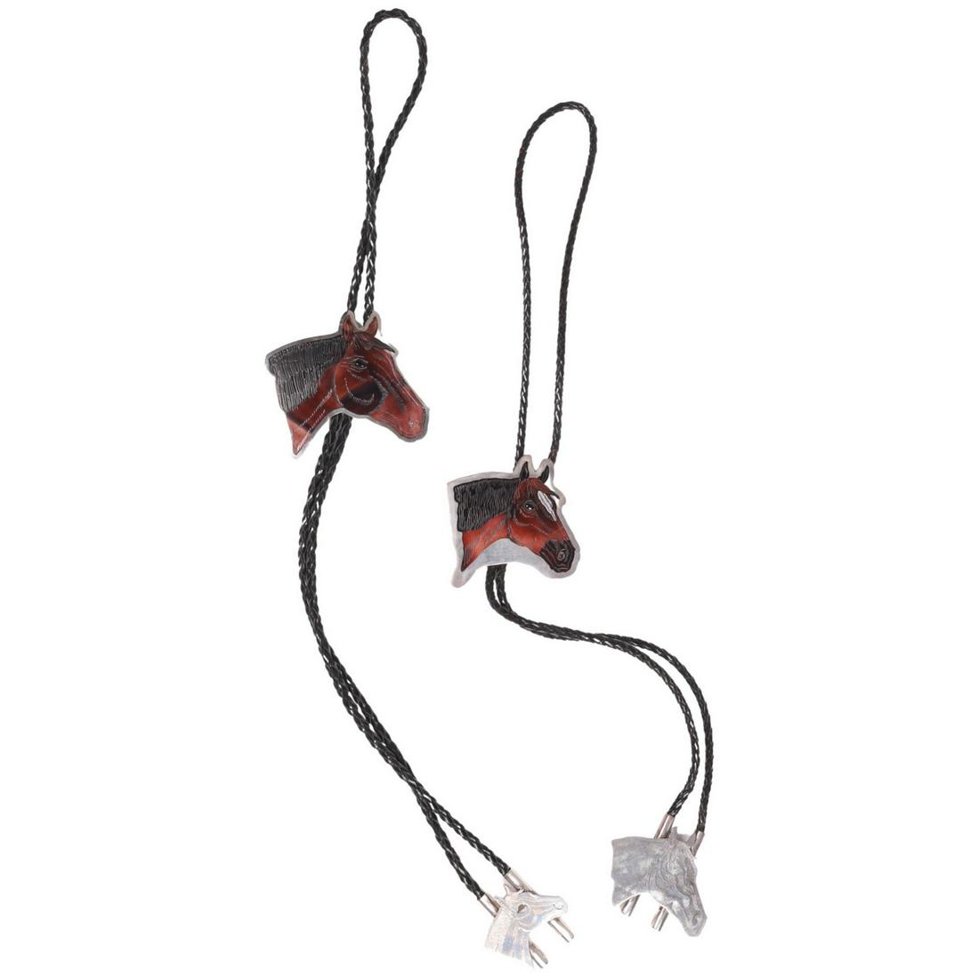 (2) Dale Edaakie Zuni Bolo Pair: Dale Edaakie Zuni bolo pair, inlaid onyx and shell silver horse head and braided leather, 22"L, each stamp signed at back