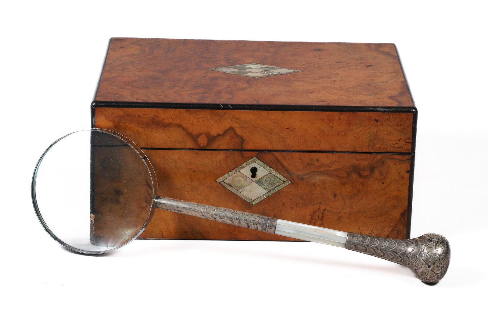 Sterling and MOP Magnifying Glass and Box: Sterling and MOP magnifying glass and box to include sterling and mother of pearl pattern etched parasol handle joined to newer magnifying glass, 13-3/4"L and walnut veneered black lacquer trimmed dre