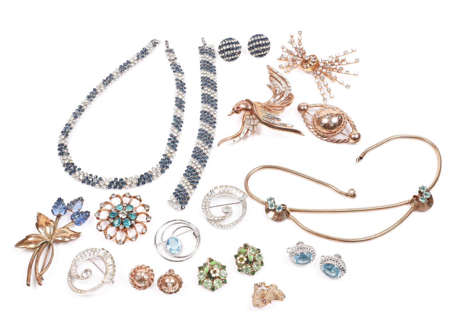 Designer Costume Jewelry: Designer costume jewelry to include blue and white rhinestone Trifari necklace, bracelet and earrings, some stones included for repair, sterling Danecraft brooch and earrings, Scitarelli brooch, Louis