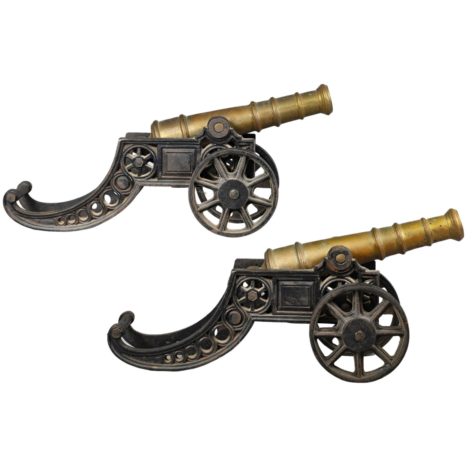 Cast Iron and Brass Cannon Pair: Cast iron and brass cannon pair, 18"L, cast iron wheeled base with brass cannon.