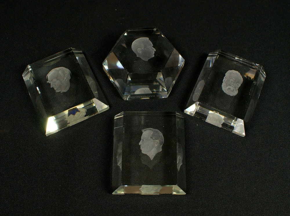 4 Kosta Lindstrand Lead Crystal Paper Weights wit: 4 Kosta Lindstrand Lead Crystal Paper Weights with figural portrait theme including: Thomas Edison, # 23, Alan B Shepard Jr, # 23, 3"w, Alexander Grahmn Bell, # 59, 3" w, small chips, and Dag Hammarsk