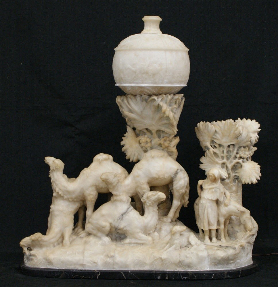 Aristide Petrilli, Florence 19th C, alabaster lam: Aristide Petrilli, Florence 19th C, white alabaster lamp base with 4 camels, dog, woman, donkey, palm trees, on black marble base, alabaster shade with landscape of people, buildings, palm trees & cam