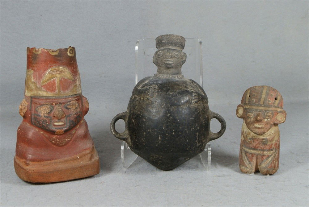 3 Peruvian Pre-Columbian Terracotta Vessels, figur: 3 Peruvian Pre-Columbian Terracotta Vessels, figure with 2 string holes, 5" h, redware figure vessel with chipped top, 8" h, blackware figure jug, 8" h.