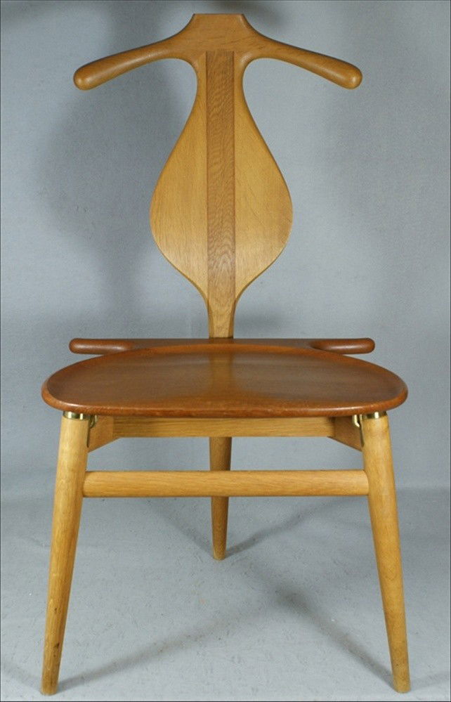Hans Wegner/ Johannes Hansen valet chair with cont: Hans Wegner/ Johannes Hansen valet chair with contoured back, and hinged seat concealing a small storage compartment, on tapering three-legged base, branded mark, 38" x 20" x 18"