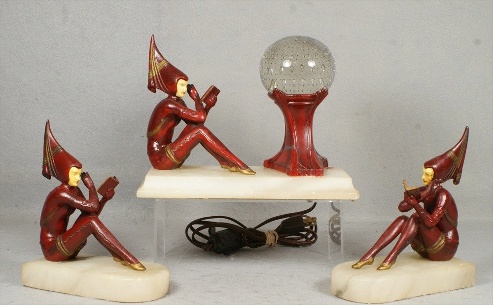 3 pc Gerdago "The Reader" bookend/light set, paint: 3 pc Gerdago "The Reader" bookend/light set, painted celluloid faces, clear glass floating bubble globe, bookends 7 3/8" h, 6 1/2" l, lamp 10" w, 7 1/2" h, old red and gold repaint, one bookend with h