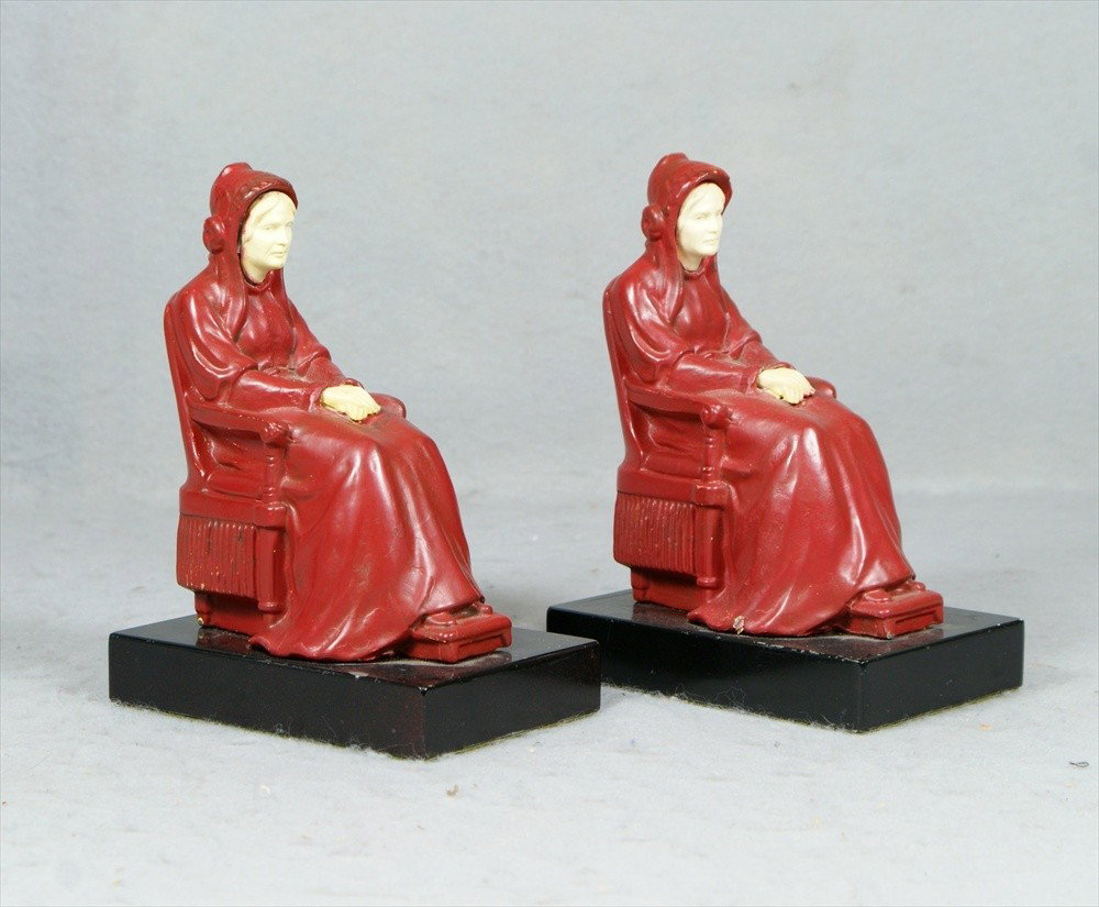 Pr JB Hirsch Whistlers Mother patinated white meta: Pr JB Hirsch Whistlers Mother patinated white metal bookends, celluloid heads and hands, black stone bases, small paint chip on each figure and one base, 5" l, 6 1/2" h