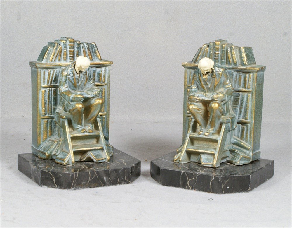 Pr JB Hirsch Man Reading in Library patinated whi: Pr JB Hirsch Man Reading in Library patinated white metal bookends, celluloid heads, signed, veined black marble bases, 6 3/8" h, 4 3/8" d, minor wear on finish