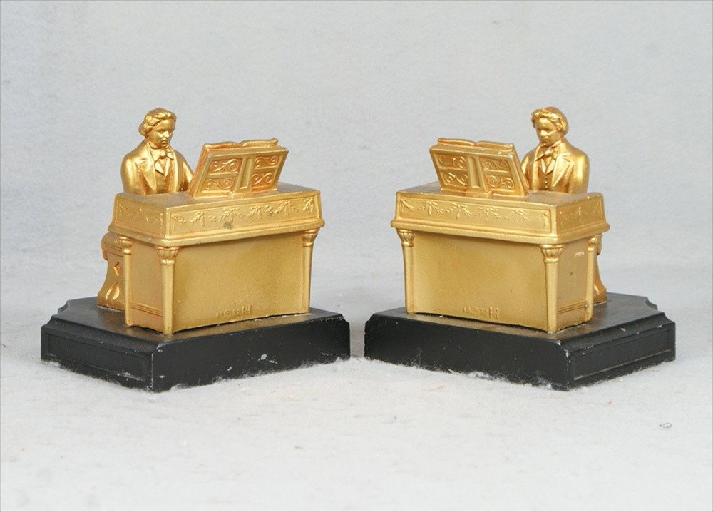 (3) Pr JB Hirsch/J Ruhl Beethoven bookends, 2 w/m: (3) Pr JB Hirsch/J Ruhl Beethoven bookends, 2 w/metal base, repainted gold,1 missing keyboard & splits in base, 5 1/2" l, 5 1/4" h, the 3rd pair original finish, black stone base, missing keyboards, s
