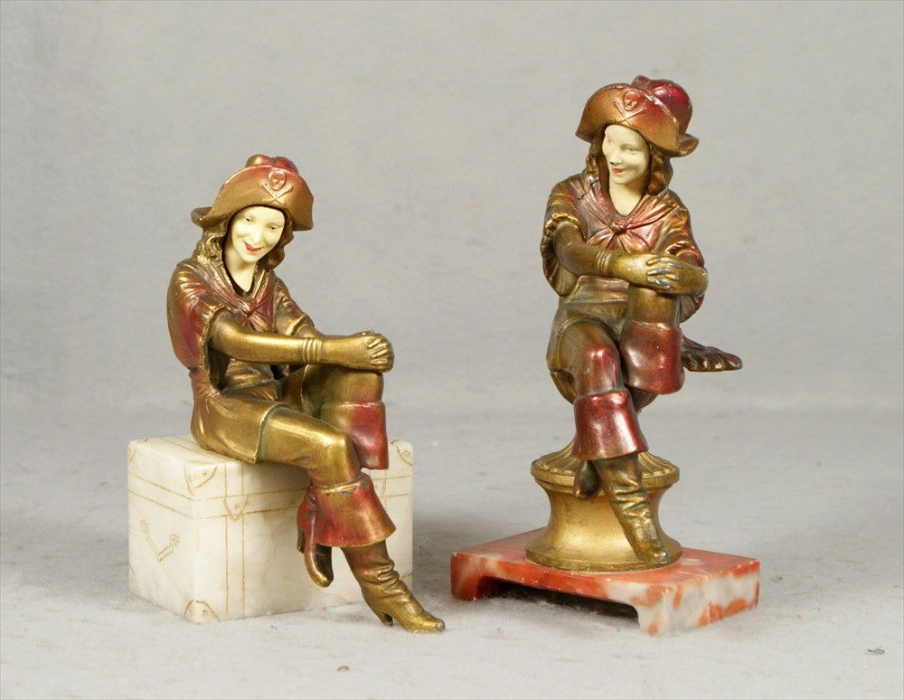 (2) single JB Hirsch patinated white metal Lady P: (2) single JB Hirsch patinated white metal Lady Pirate figure/bookends, one on an alabaster base, 6 1/4" h, the other on a rose alabaster platform base, 7 1/2" h