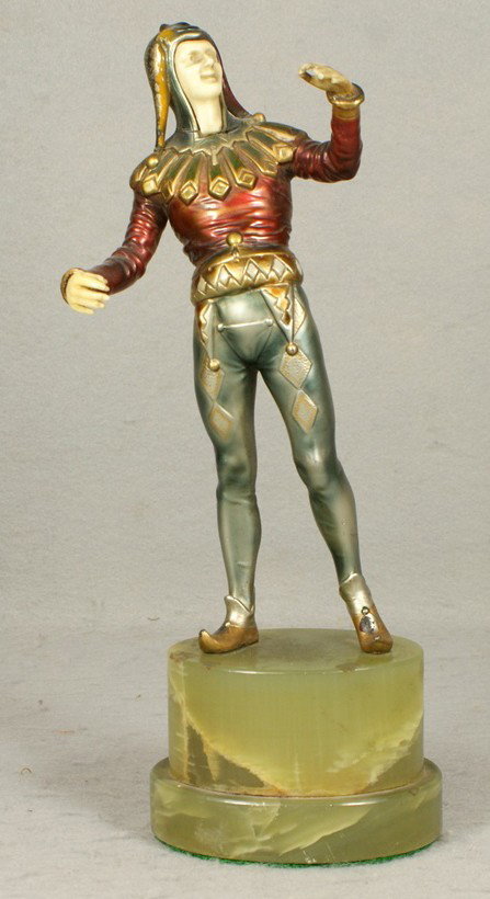 Unsigned art deco patinated white metal sculpture: Unsigned art deco patinated white metal sculpture of a jester with ivorine head and hands (3 broken fingers) on green alabaster base, 10 1/2" tall