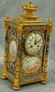 L Marti gilt bronze, champleve, and Sevres porcela: L Marti gilt bronze, champleve, and Sevres porcelain French mantle clock, rhinestone encrusted dial and front panel, dial marked A Stowell & Co, Boston, 17" tall, both barrel springs are wound tight &