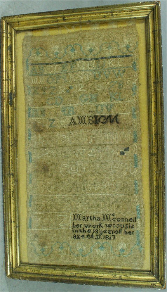 Needlework alphanumeric sampler, "Martha McConnel: Needlework alphanumeric sampler, "Martha McConnell her work wrought in the 13 year of her age, AD 1817", American, 17" x 8 1/2", shingle back early gilt frame, browned, but no damage