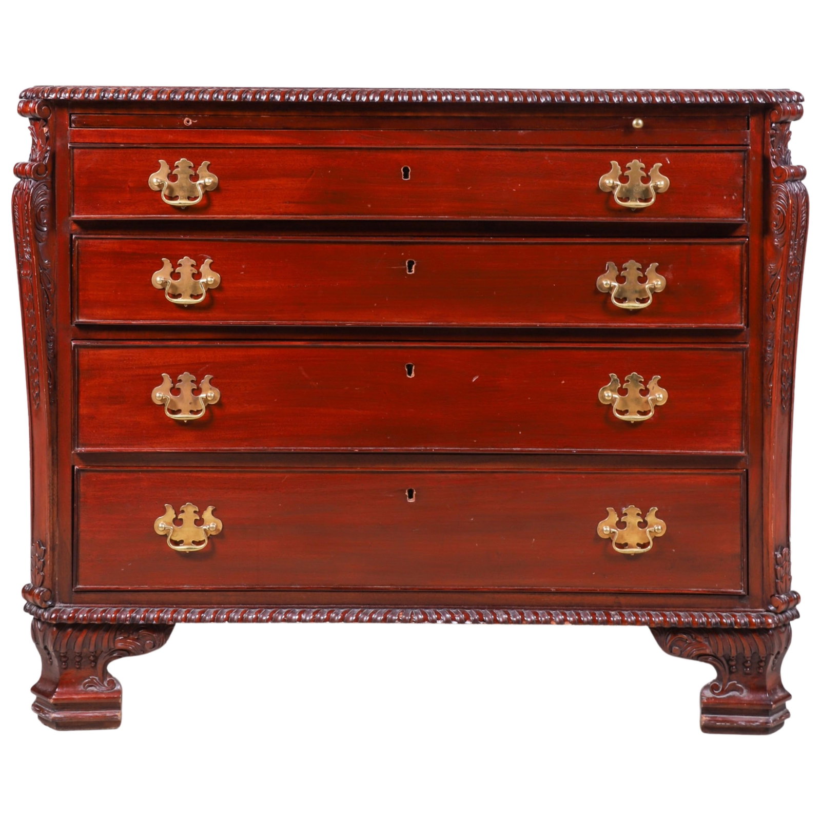 Mahogany carved chest of drawers: Mahogany carved chest of drawers, gadrooned edge surrounding top, pull out slide over 4 graduated drawers, over gadrooned skirt, flanked by acanthus columns, 36"h x 44"w x 20"d, light wear to top, pul