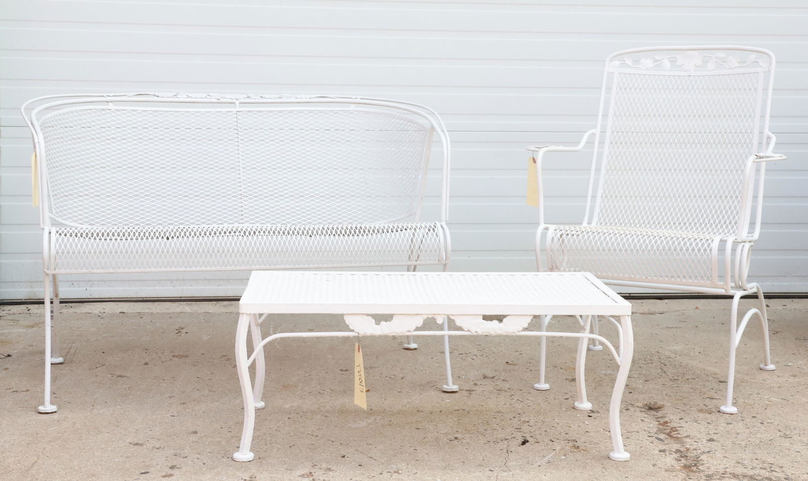 (3) pc Salterini style patio seating set: (3) pc Salterini style patio seating set, c/o bench, armchair, coffee table, white painted, grated seats and table top, floral decoration, largest 30"h x 45"w x 26"d