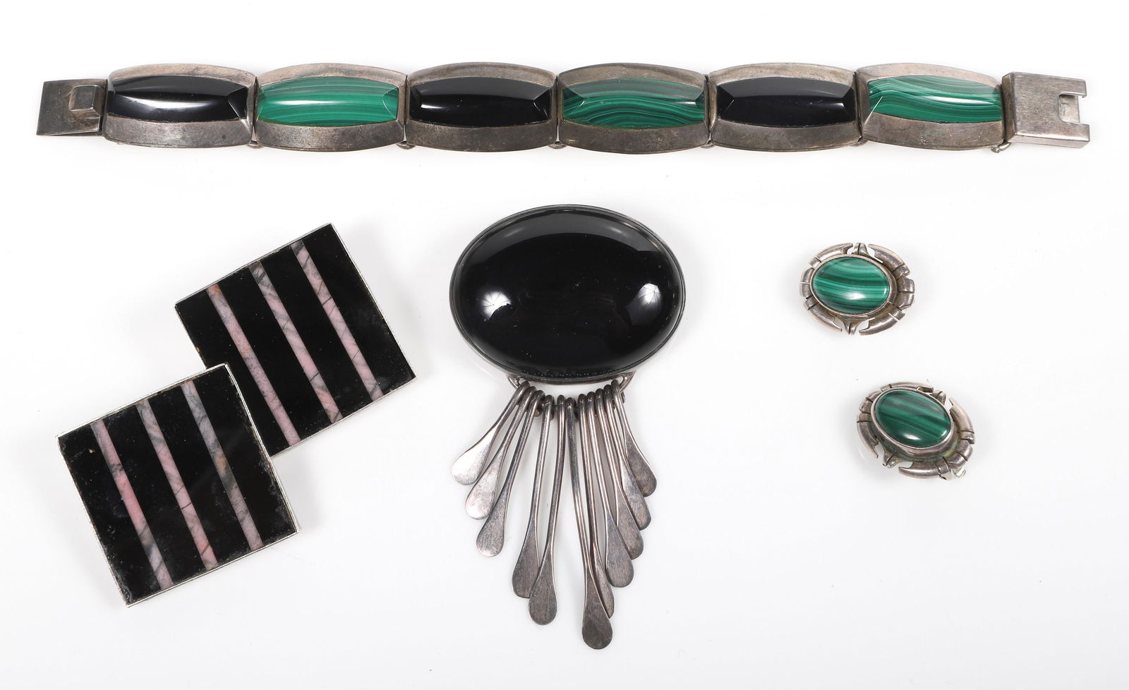 (4) Sterling and Stone Jewelry Pieces: (4) Sterling and stone jewelry pieces to include oversized onyx and sterling pendant pin, sterling onyx and malachite bracelet, onyx and sterling modernist clip earrings and malachite and sterling cli