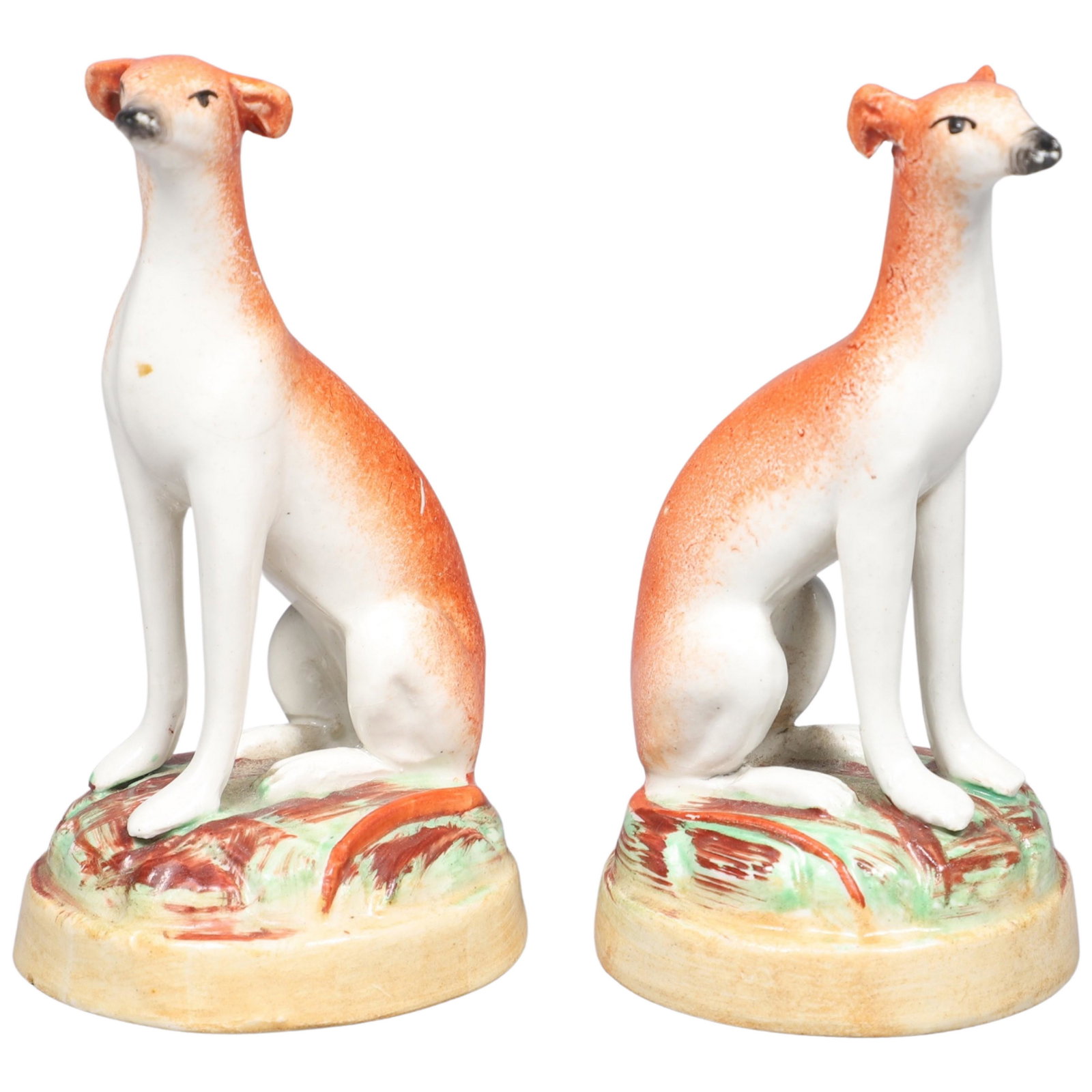 Pair of Miniature Staffordshire Dog Figures: Pair of miniature Staffordshire pottery whippet dog figurines, marked England 80, 4" h)