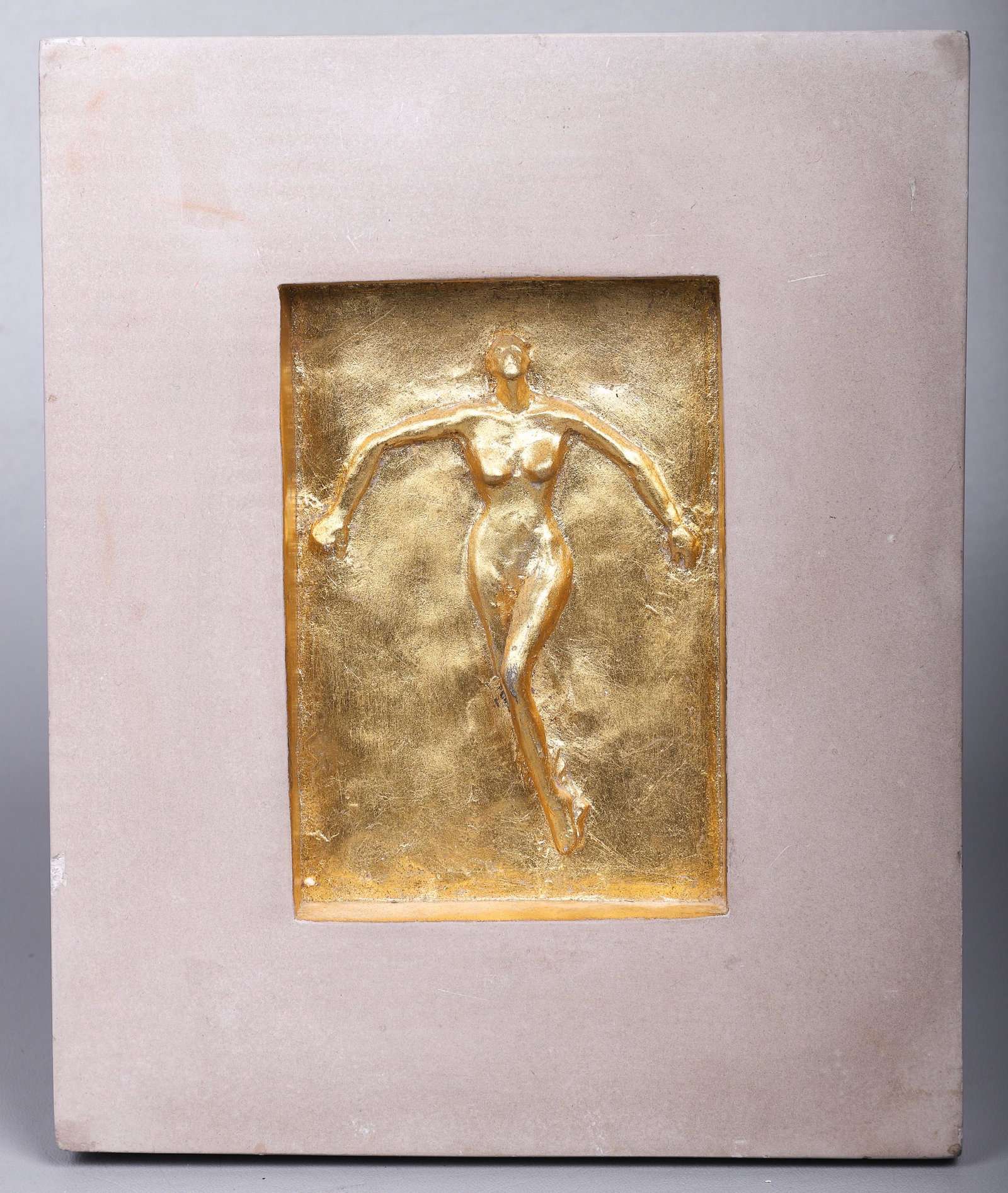 Gilt Relief Nude Female Wall Plaque: Gilt relief nude female cast stone wall plaque, original design by MarCo MAC Sculpture Inc Style 624, 11" x 9" overall, chips to edges