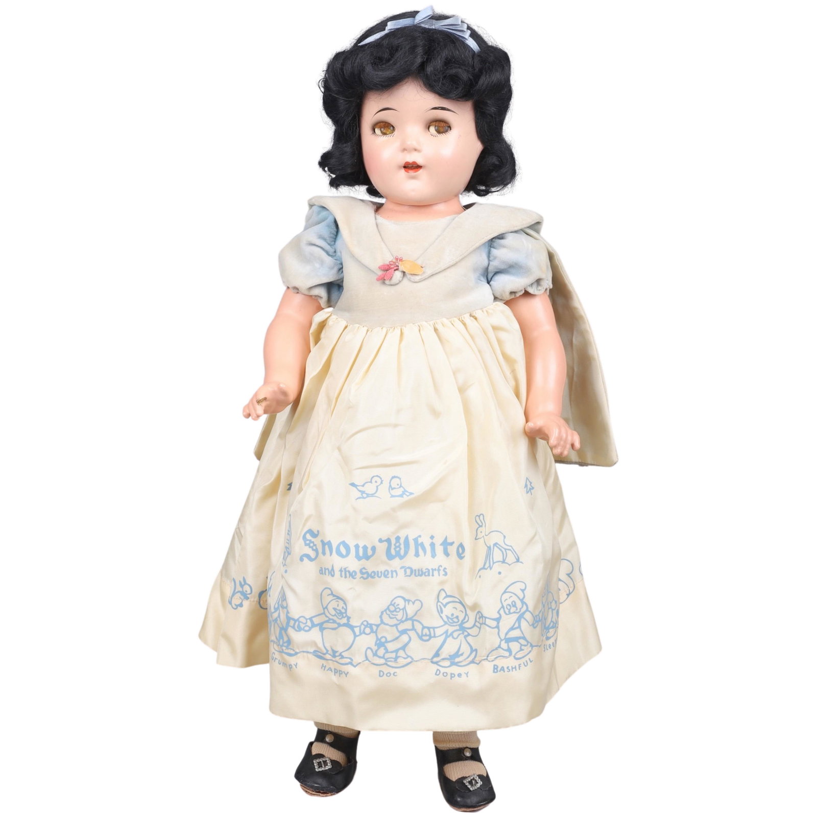Disney Shirley Temple Snow White Doll: Composition Snow White doll, sleep eyes, open mouth with 4 teeth mohair wig, wearing original blue velveteen & yellow rayon dress with illustrations around skirt hem, matching cape and collar, origina