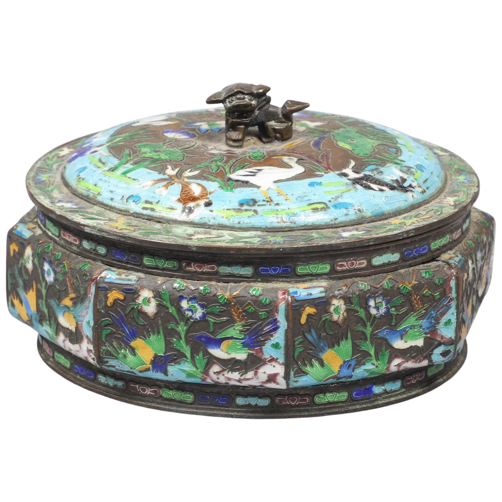 Japanese Champleve Covered Jar: Japanese champleve covered jar, in brightly enameled bird, foliage, fish and water scenic surround, with fu lion finial, 5-3/4" dia