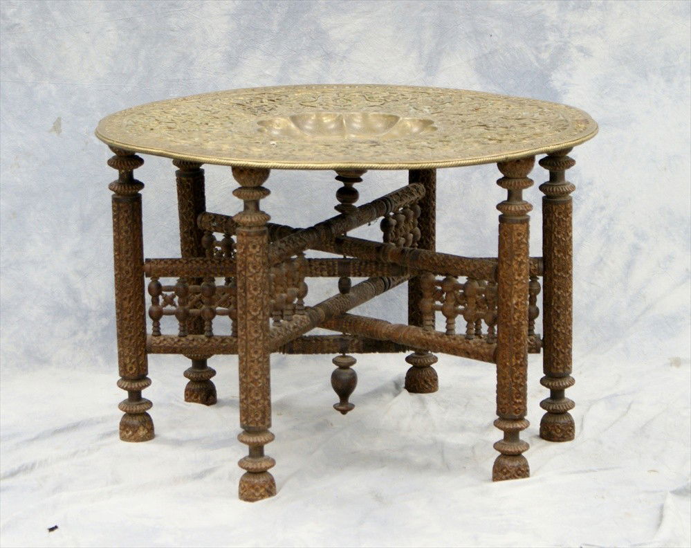 Large Middle Eastern carved wood 6-legged table: Large Middle Eastern carved wood 6-legged table with brass tray top, circa 1900, approx. 21" high