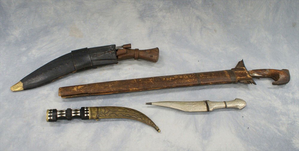 (4) Weapons, c/o wavy bladed knife in sheath, ma: (4) Weapons, c/o wavy bladed knife in sheath, machete in sheath, small metal mounted dagger, brass dagger with ebony & MOP handle, longest 27"