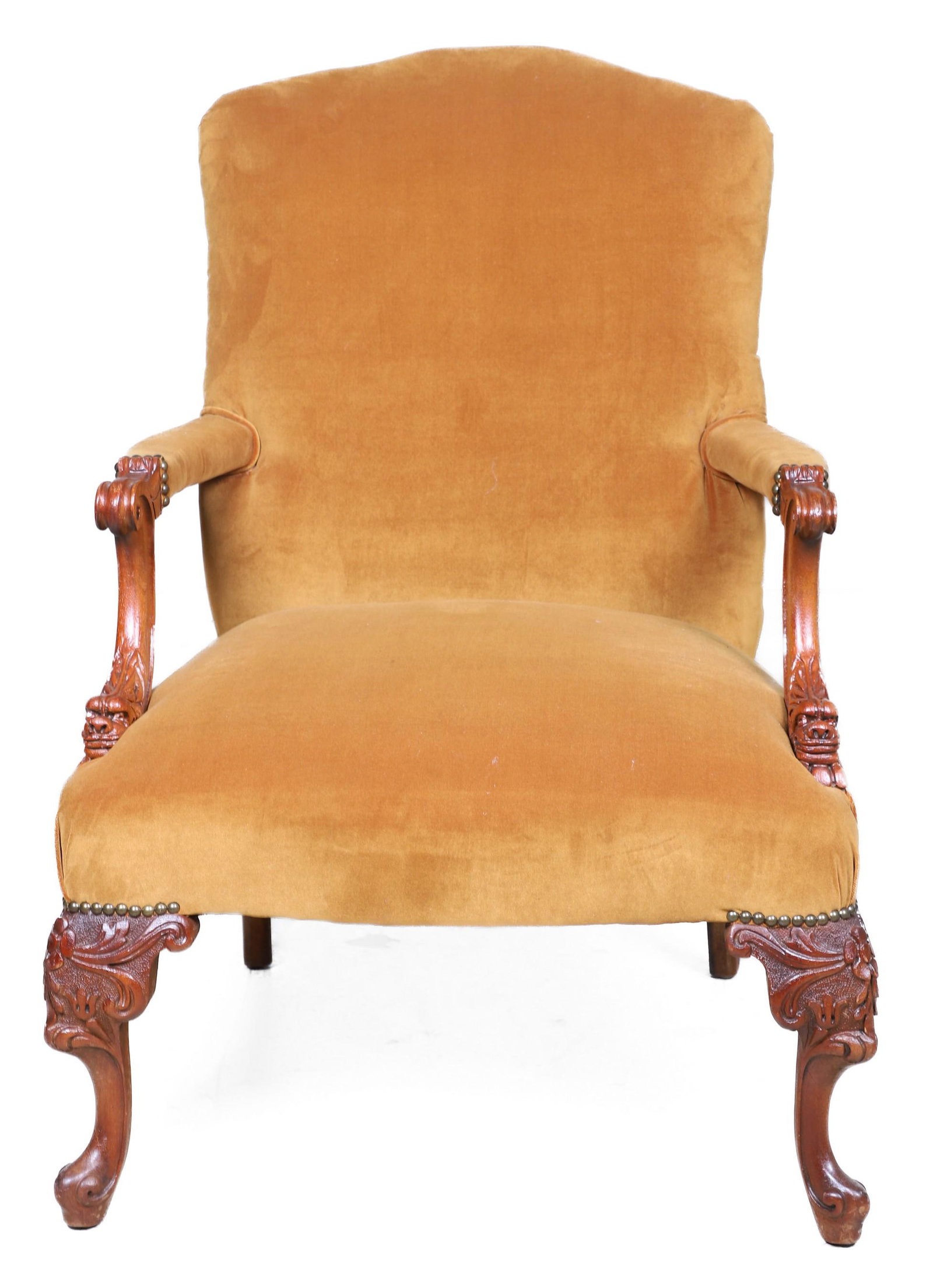 Italian style carved open armchair: Italian style carved open armchair, velvet upholstery, with scrolled arms over griffins heads, over acanthus and floral decoration at knees on scrolled feet, 40"h x 26-1/2"w x 24"d